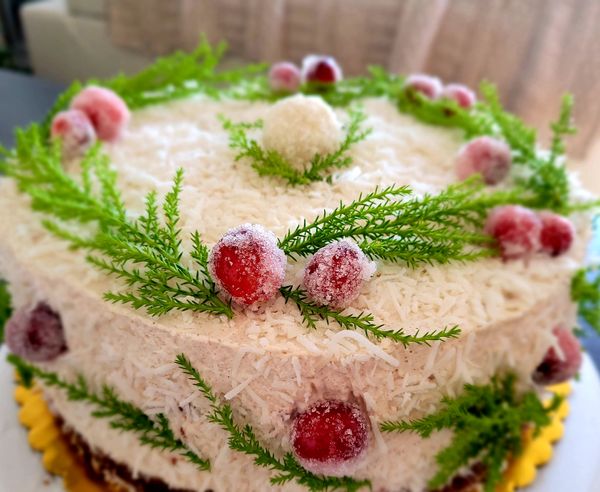 A Celebration cake with coconut and seasonal decorations